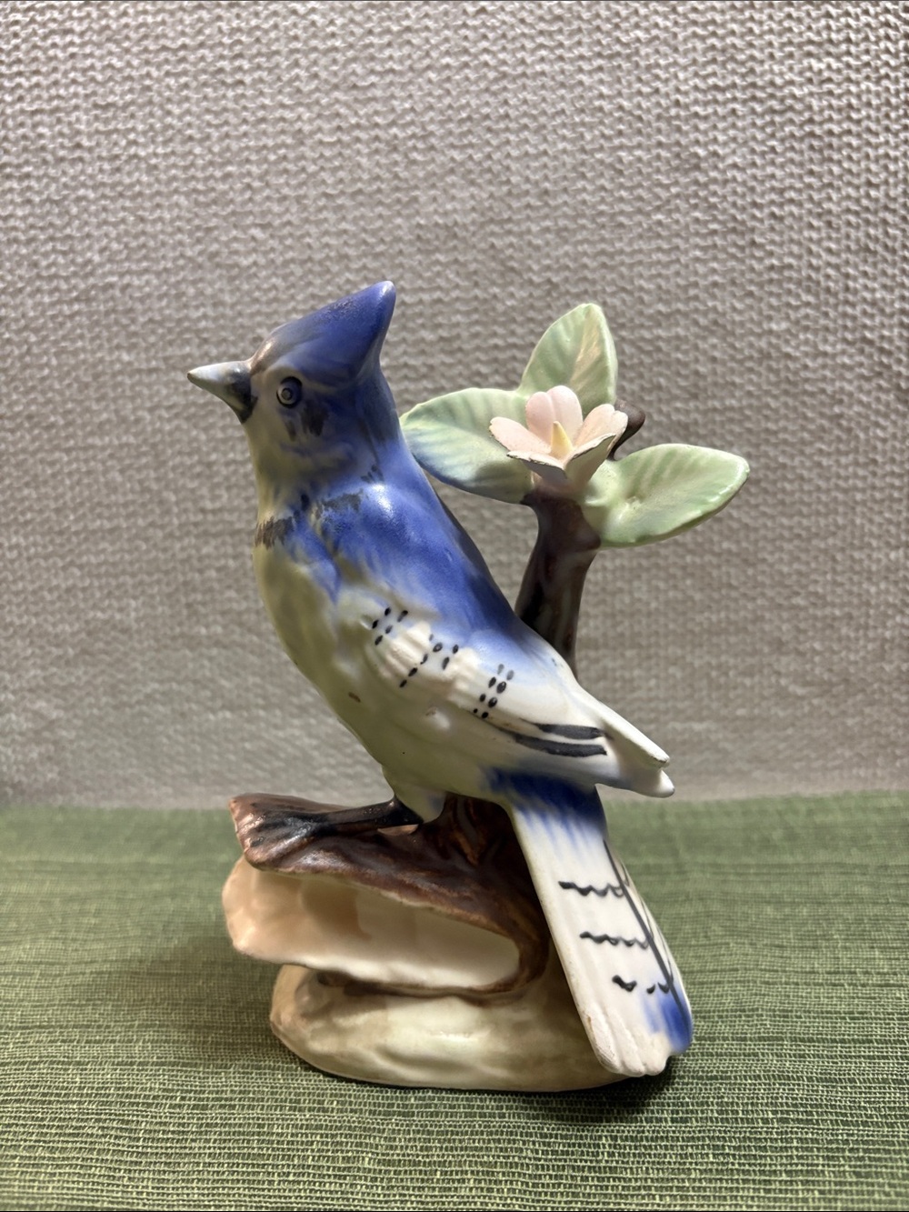 Hand-Painted Blue and White Ceramic Bird Figurine with Floral Accent